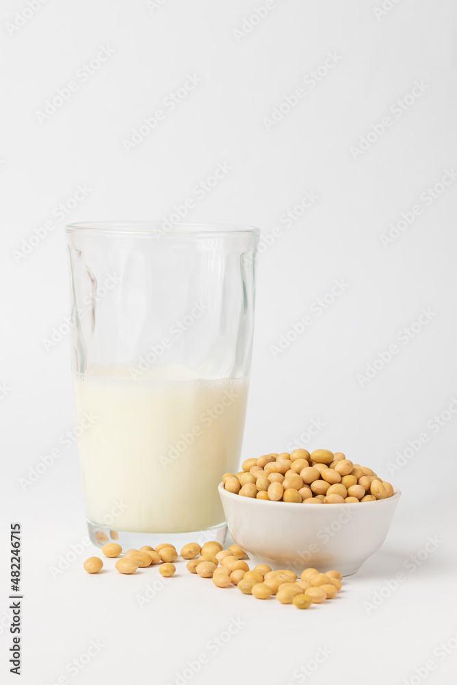 High protein product soybeans is popular ingredient for variant of vegetable milk. Dry, raw soybean, soy bean, or soya bean one of types asian legume in boul white background. High protein product soybeans is popular ingredient for variant of vegetable milk. Dry, raw soybean, soy bean, or soya bean one of types asian legume in boul white background.