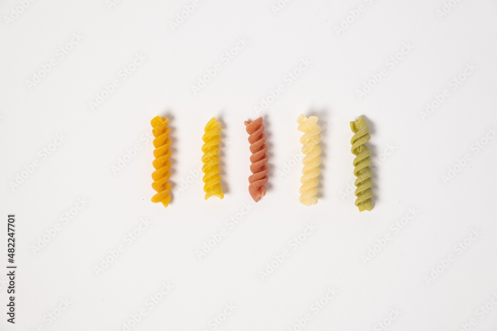 raw trottole tricolore wheat italian food macro on white background raw trottole tricolore wheat italian food macro on white background