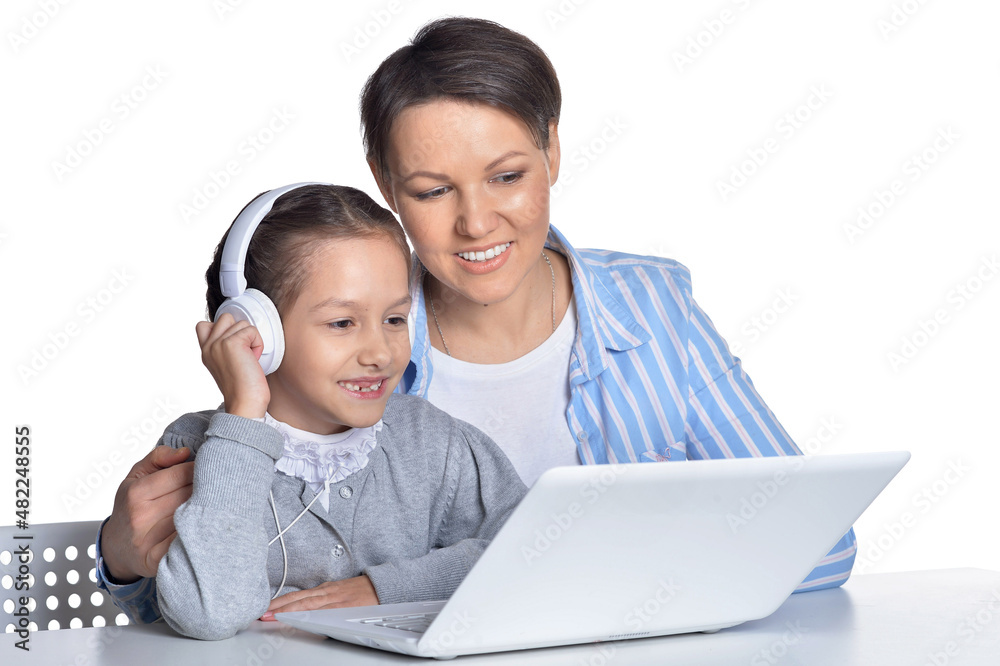 Portrait of emotional mother and daughter using laptop Portrait of emotional mother and daughter using laptop