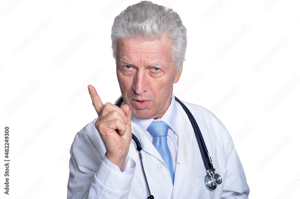 Adult doctor in white pointing on white background Adult doctor in white pointing on white background