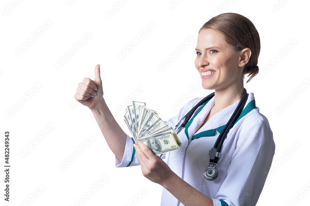 Portrait of female doctor holding money on white background Portrait of female doctor holding money on white background