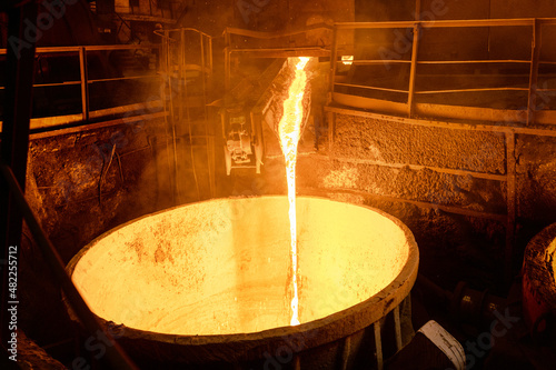 Blast furnace slag tapping. The molten slag is poured into a ladle. photo