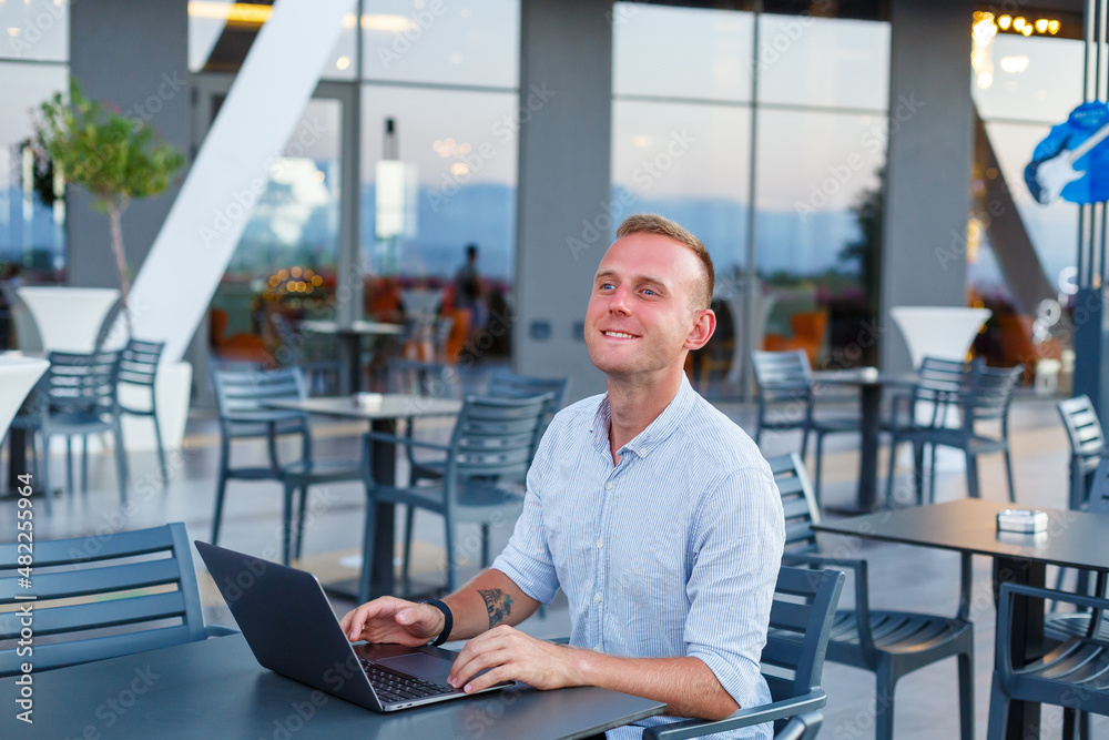 Successful male freelance businessman using laptop computer at work on vacation. Business, study, freelance. Remote work Successful male freelance businessman using laptop computer at work on vacation. Business, study, freelance. Remote work