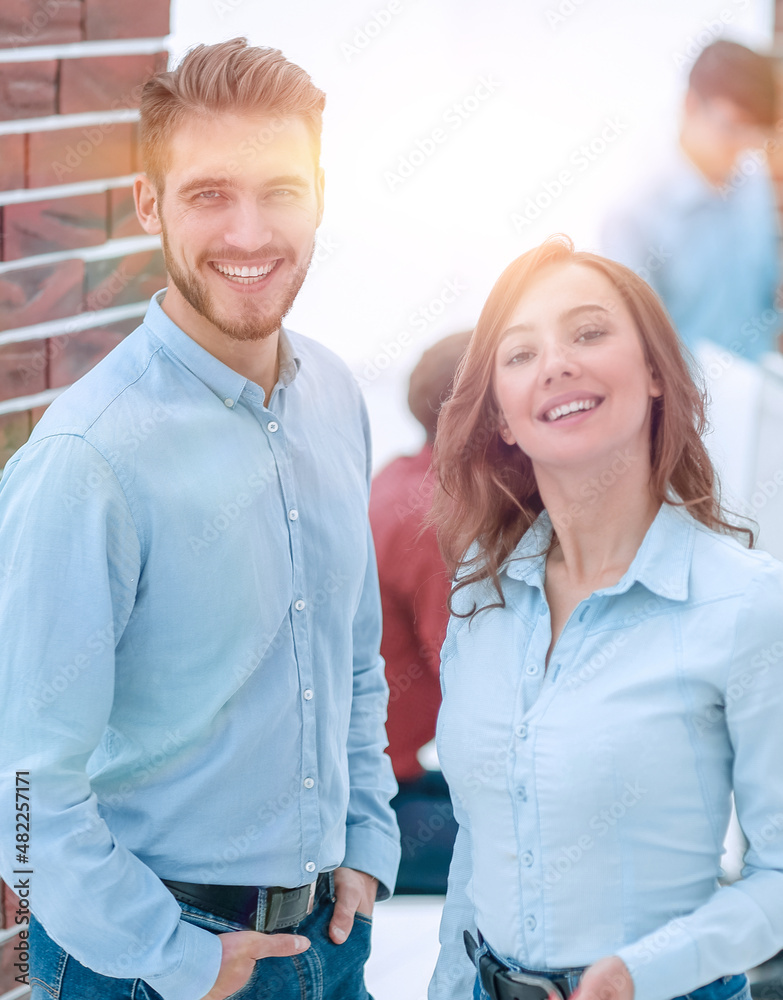 Portrait of smiling designers standing in office. Portrait of smiling designers standing in office.
