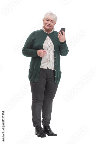 Happy senior woman holding cell phone, smartphone in hand read and write sms © ASDF
