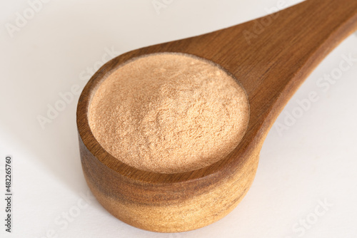 Lacuma Powder in a Wood Scoop
