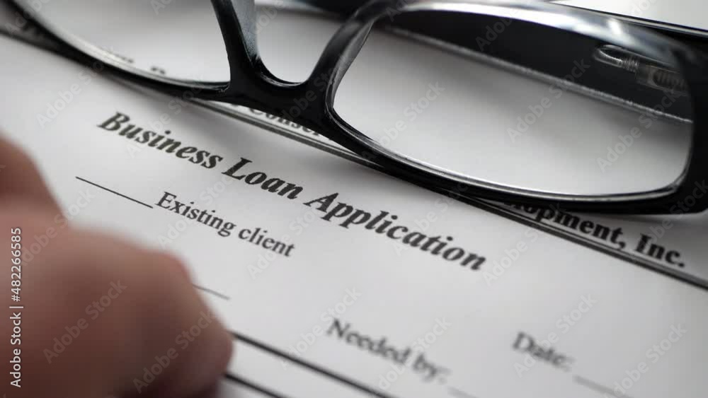 Finger tapping on business loan application