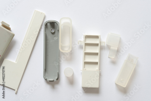 plastic doors, covers, tips, and other object on a light background