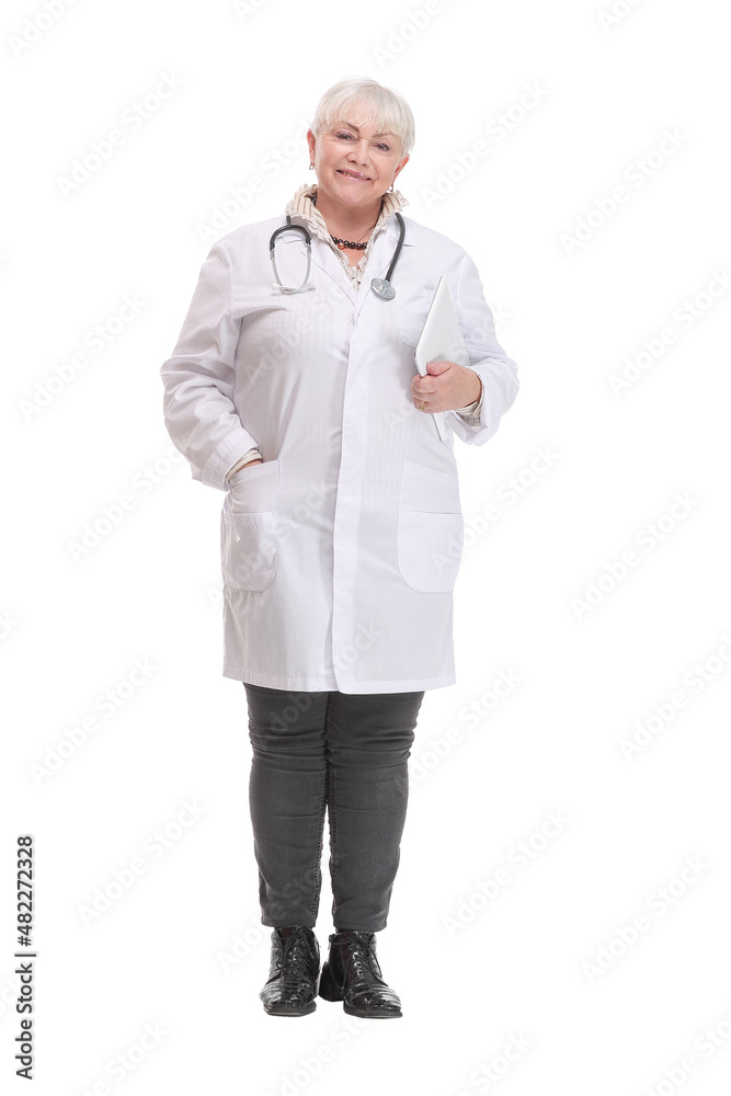 Full length of smiling woman doctor standing and using tablet Full length of smiling woman doctor standing and using tablet