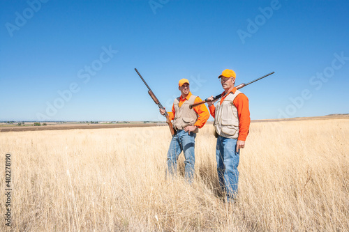 Two male adult (upland game) hunters. Hunting Dove, Quail, Pheasant, Chukar or Partridge.