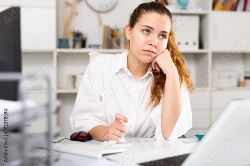 Картината върху платно Young european girl manager has problems and stress at work in modern office