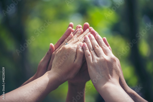 Group of teamwork high five team together hands raise up power partner. Diversity multiethnic group of business people success team together. Collaborate Volunteer friendship mission Business partner
