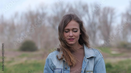 [4k] lifestyle portrait of young blonde woman in green environment