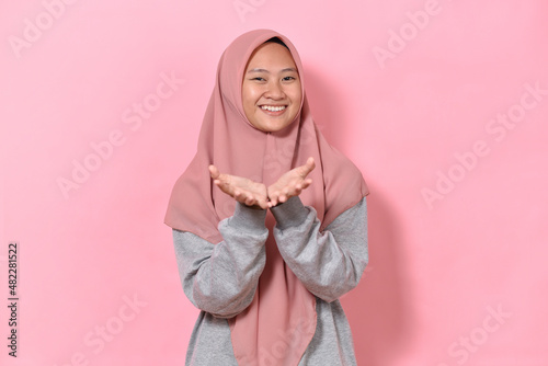 Happy Muslim woman showing her empty hands