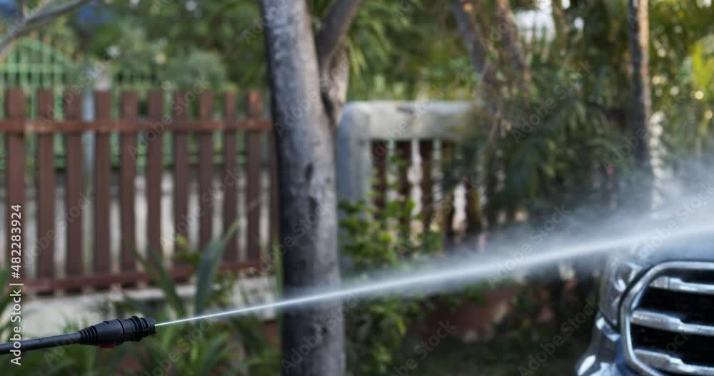 Water spray for car washing and cleaning. Water spreads while spraying into the car. Water spray for car washing and cleaning. Water spreads while spraying into the car.