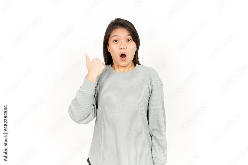 Pointing Product Using Thumb Of Beautiful Asian Woman Isolated On White Background Pointing Product Using Thumb Of Beautiful Asian Woman Isolated On White Background
