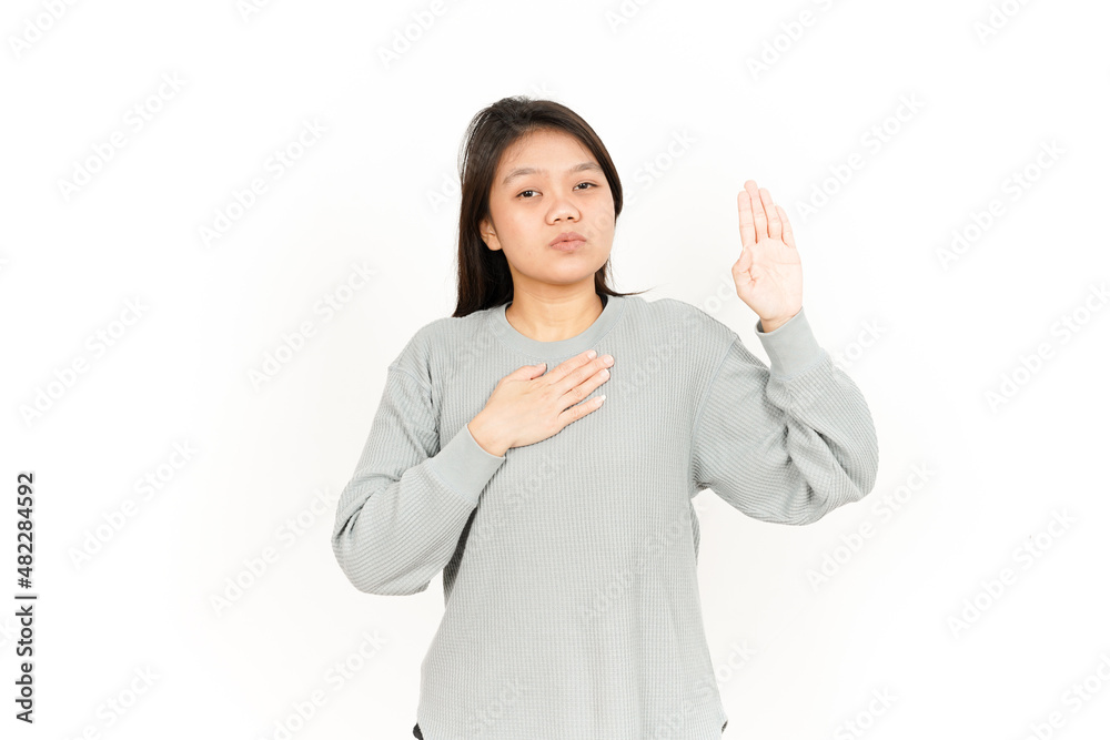Swearing or Promise Gesture Of Beautiful Asian Woman Isolated On White Background Swearing or Promise Gesture Of Beautiful Asian Woman Isolated On White Background
