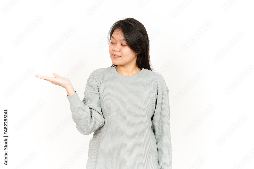 Showing Product on Open Palm Of Beautiful Asian Woman Isolated On White Background Showing Product on Open Palm Of Beautiful Asian Woman Isolated On White Background