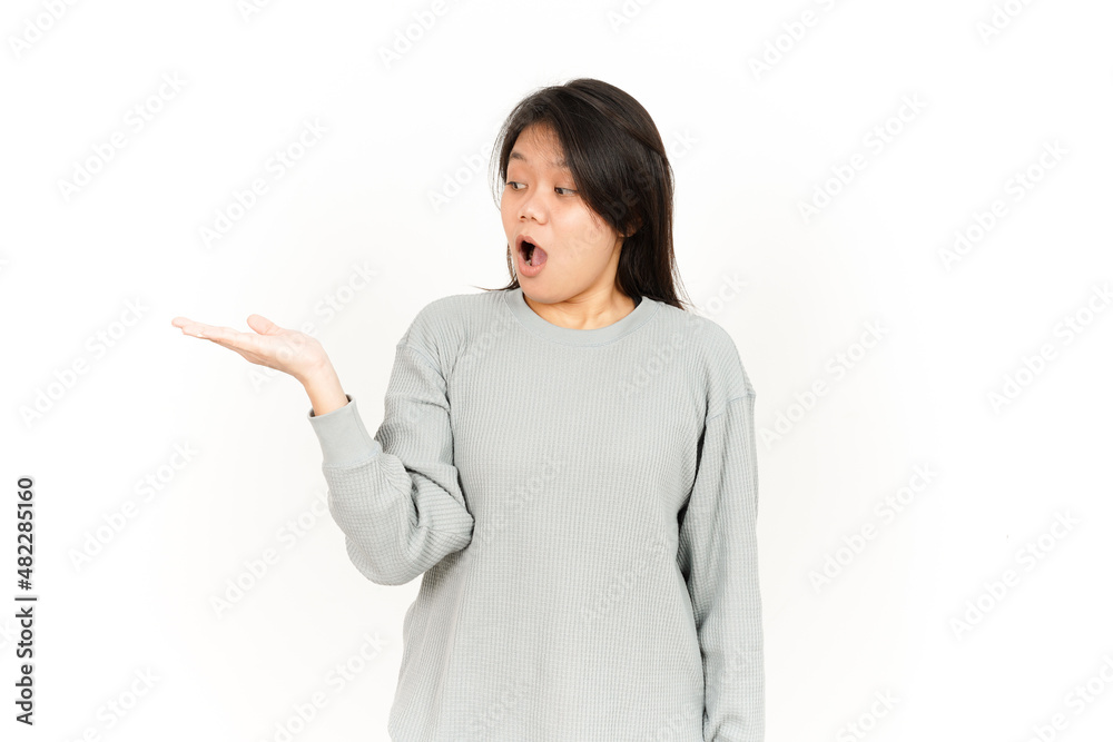 Showing Product on Open Palm Of Beautiful Asian Woman Isolated On White Background Showing Product on Open Palm Of Beautiful Asian Woman Isolated On White Background