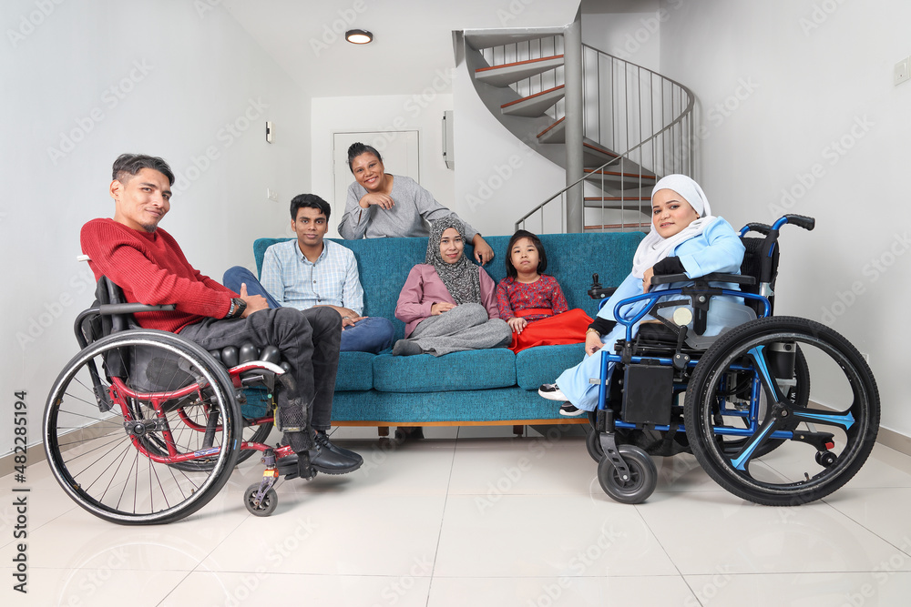 Obraz premium Group of southeast Asian adult child girl male female special need medical down adhd autism syndrome disabled wheelchair work study business discuss talk thumbs up point wave success happy