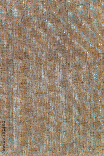 simple linen background: the reverse side of the primed canvas stretched over the frame, close, toning