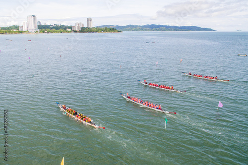 aerial view of a group of dragon boat paddler practice at Likas Bay Sabah Malaysia. Dragon boat competition is an annual event in Sabah Malaysia.