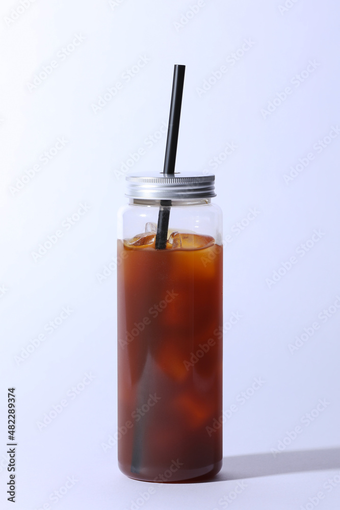 Plastic bottle with iced Americano in the white background. Plastic bottle with iced Americano in the white background.
