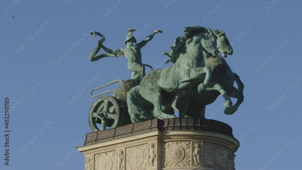 Large statue of warrior on chariot with horse. Part of Heroes Square memorial in Budapest, Hungary. Zoom in shot. Large statue of warrior on chariot with horse. Part of Heroes Square memorial in Budapest, Hungary. Zoom in shot.
