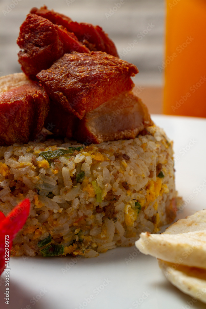 Rice with fried pork for Colombian gourmet breakfast