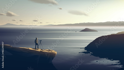 a photographer is patiently taking a photo of the beautiful sunset on the cliff with a breathtaking background of the vast coastline