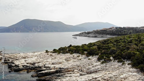 Tranquil Scenery With Boats On The Ocean In Alexia Beach, Greece - aerial drone shot