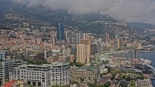 Monaco Aerial v18 establishing shot drone fly around modern metropolitan area capturing luxurious hotel hermitage, casinos and seaside resorts and apartments - July 2021 photo