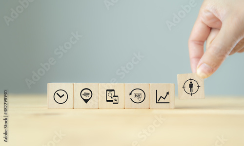 Contexual marketing concept. Customer behavior data analysis. Personalized marketing strategy with data driven. Hand holds wooden cubes with personalization icon standing with customer behaviors.