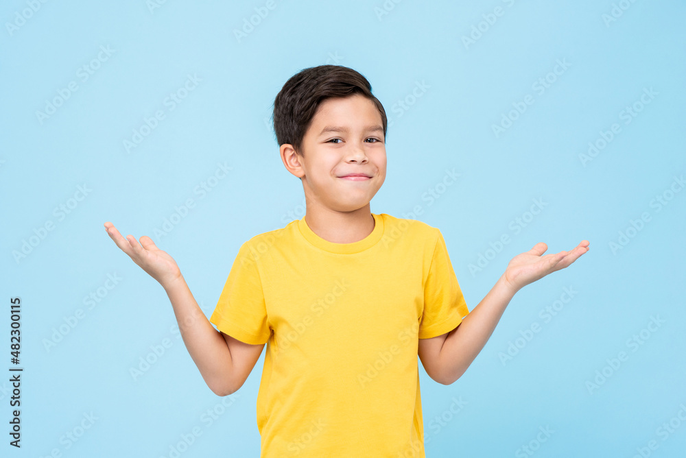 Puzzled mixed race boy shrugging shoulders Puzzled mixed race boy shrugging shoulders