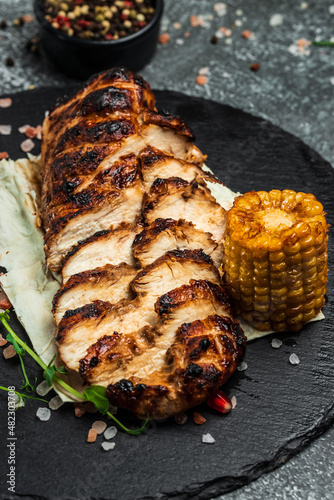 Barbecued chicken breasts on slate plate, Roasted Chicken fillet, grilled chicken fillets with vegetables, Healthy fats, clean eating for weight loss, top view