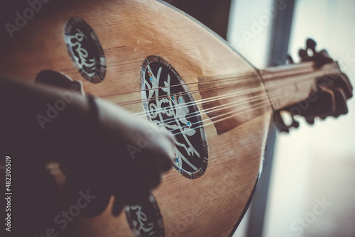 Fotografie Musician Playing Note on Instrument Oud during the concert