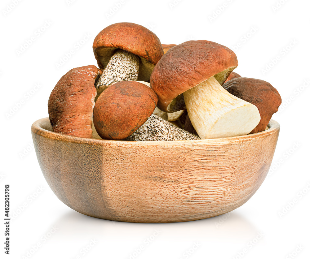 wooden bowl with forest mushrooms on an isolated white background wooden bowl with forest mushrooms on an isolated white background