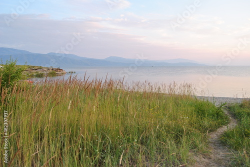 Seascape. Beautiful lake shore. Gentle clouds and blue water surface. Bukhtarma reservoir.