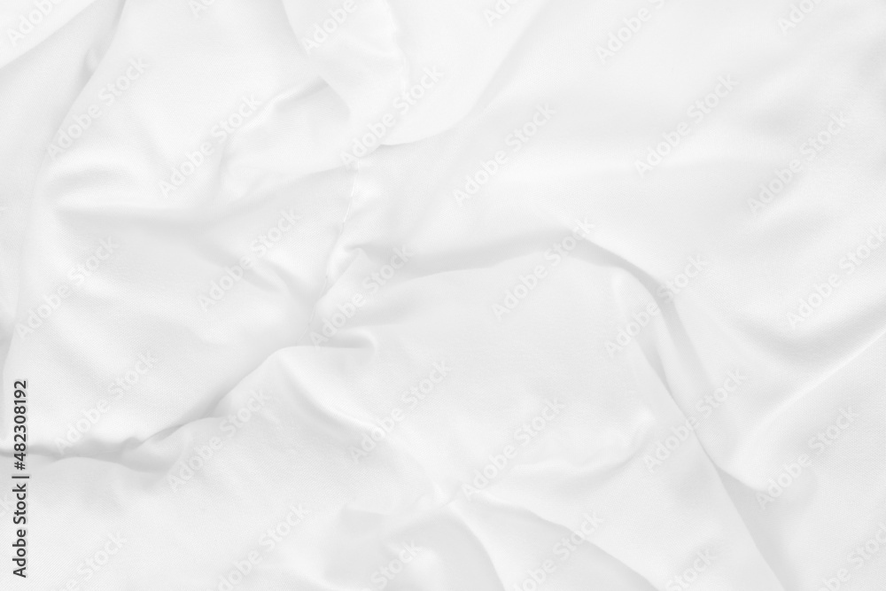 Close up top view of white bedding sheet and wrinkle messy blanket in bedroom after wake up in the morning. Close up top view of white bedding sheet and wrinkle messy blanket in bedroom after wake up in the morning.
