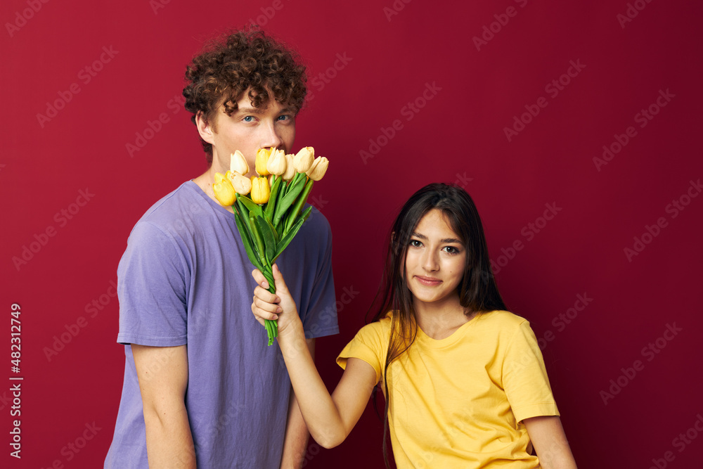 young boy and girl bouquet of flowers gift romance isolated background unaltered
