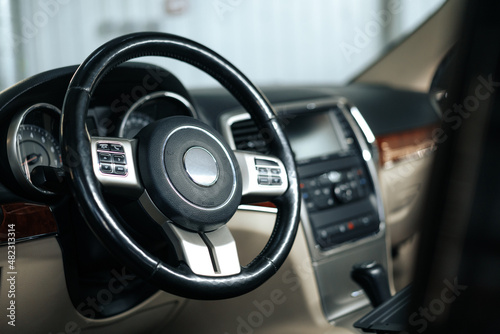 Modern car interior, steering wheel and dashboard © fotofabrika