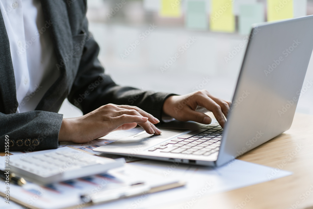 business report spreadsheet. businessman using computer prepare financial report business report spreadsheet. businessman using computer prepare financial report