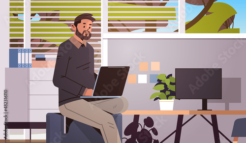 businessman working on laptop business man freelancer using notebook at workplace modern office interior