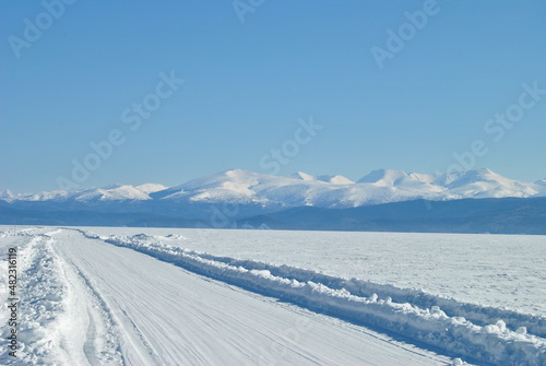 Baikal. Baikal ice. Winter road on Lake Baikal. Siberia. © Anton