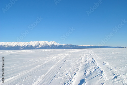 Baikal. Baikal ice. Winter road on Lake Baikal. Siberia.