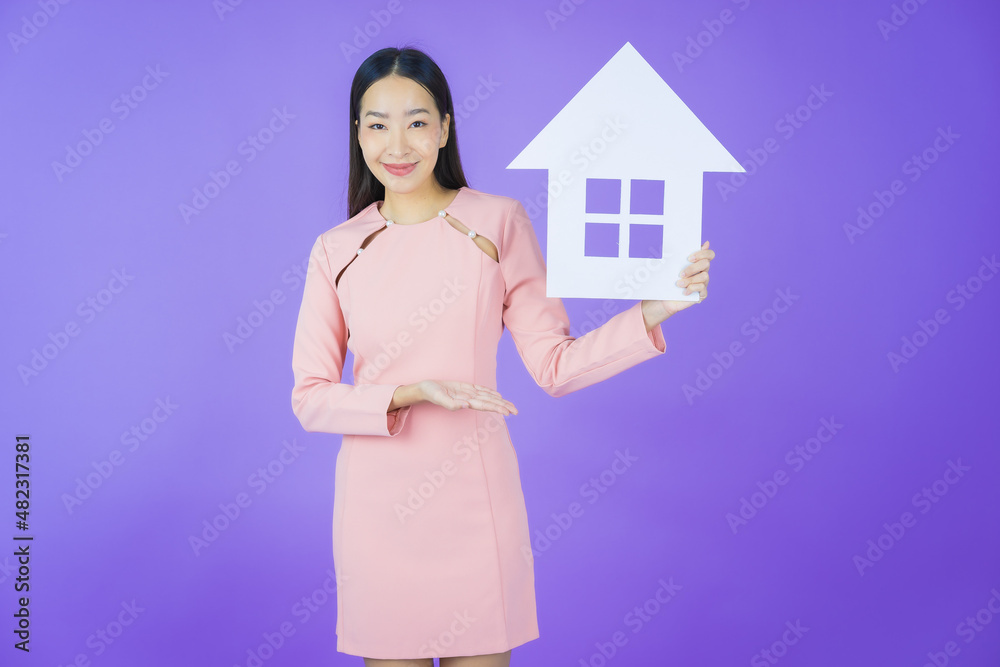 Portrait beautiful young asian woman with house or home paper sign Portrait beautiful young asian woman with house or home paper sign