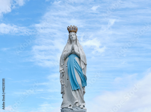 sculpture of the Virgin Mary in the sanctuary ofLourdes, France. place of worship and pilgrimage for christians