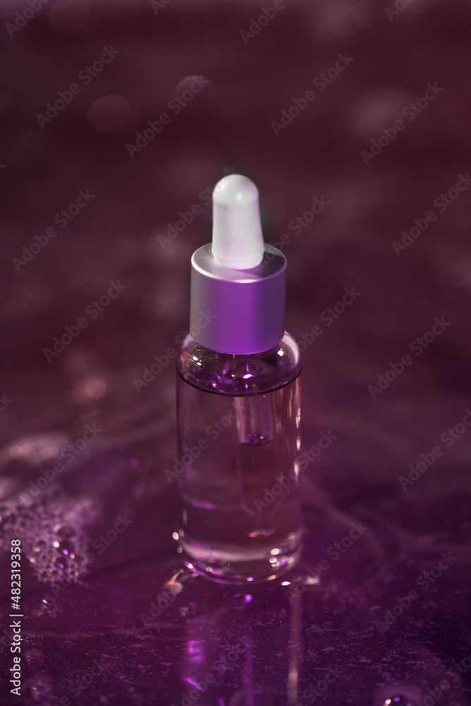 glass bottle with cosmetic liquid, beauty concept