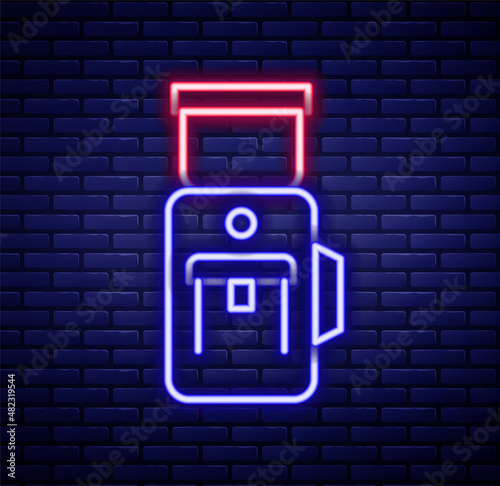 Glowing neon line Electric coffee grinder icon isolated on brick wall background. Colorful outline concept. Vector