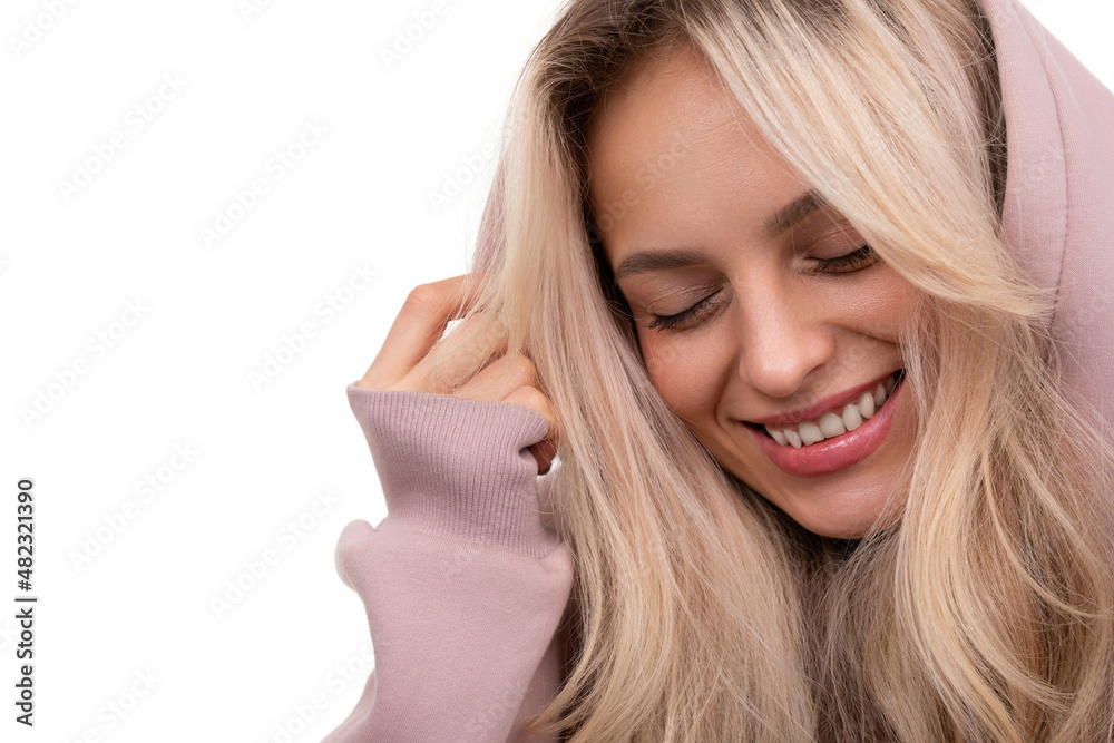 close-up portrait of a young woman with a smile on her face and a hood on her head close-up portrait of a young woman with a smile on her face and a hood on her head
